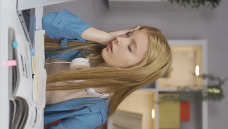 Vertical-video-of-Female-student-with-migraine.